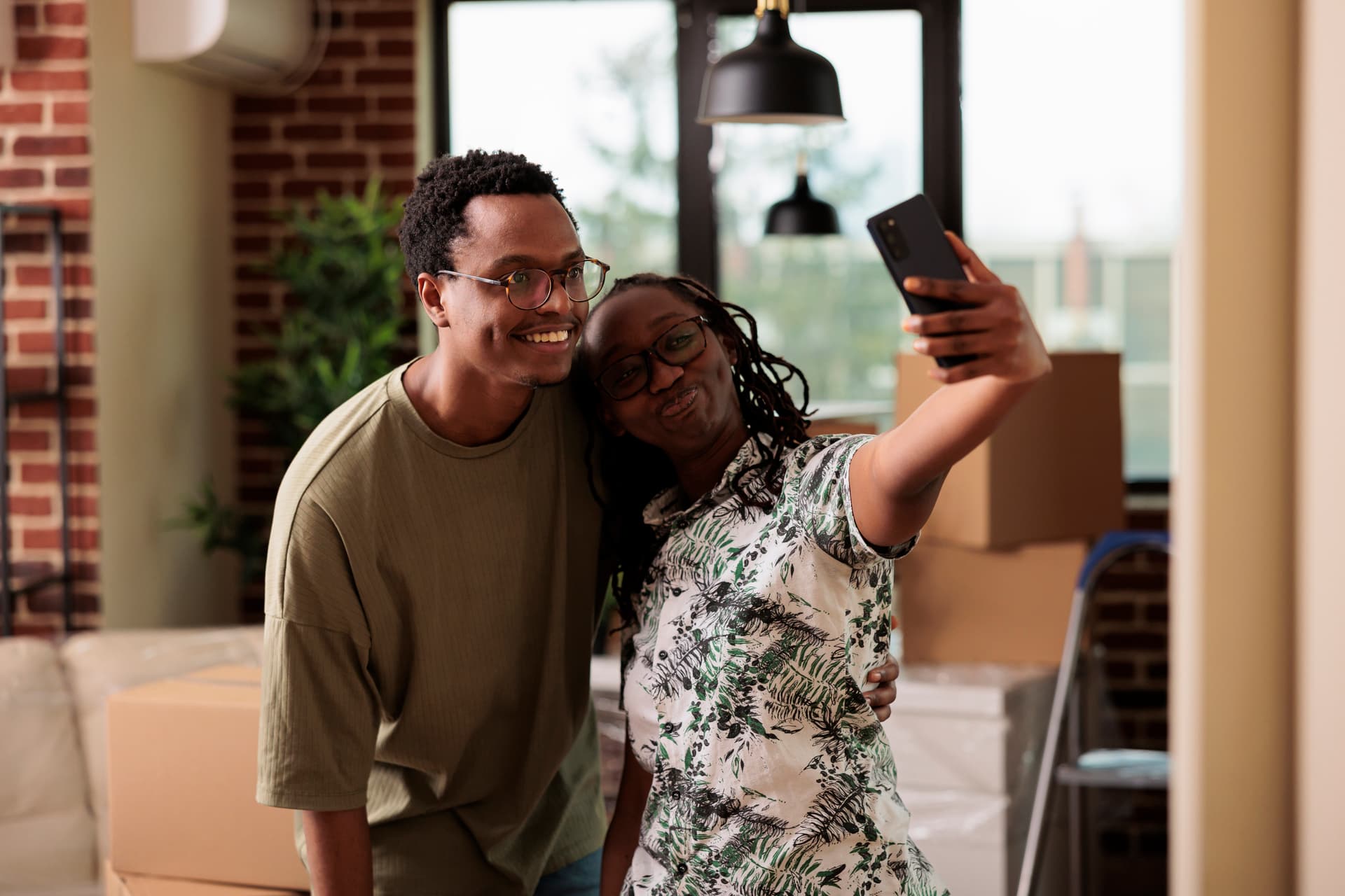 Couple taking a selfie in their new home