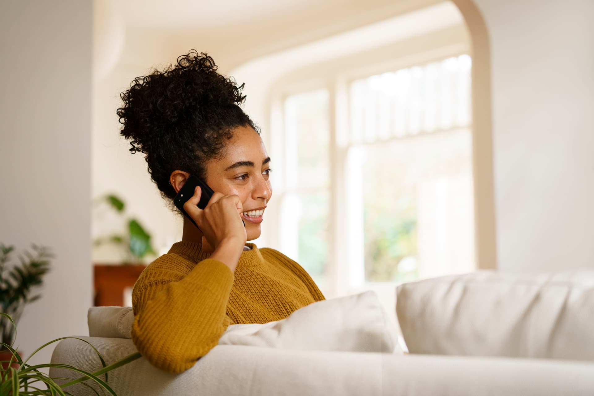 Person getting help on the phone at home